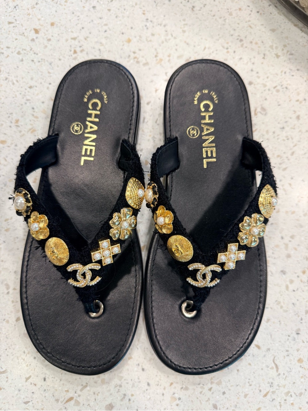 CHANEL Black Leather and Embellished Flip Flop Sandals with Gold Accents